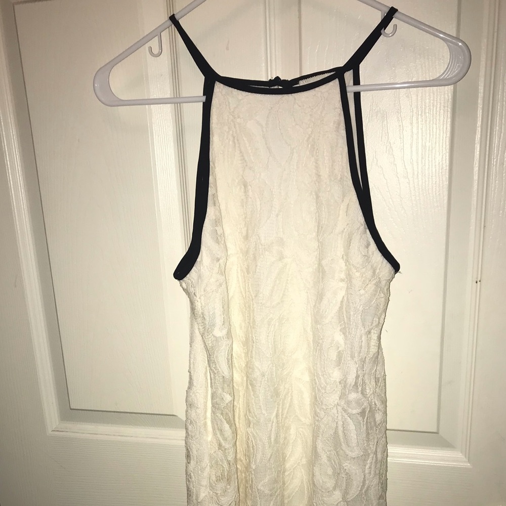 Cream colored dress with black straps